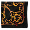 A square black scarf featuring an intricate graphic print of interwoven golden and brown leather reins and bits, with small red tassels, shown flat against a white background.