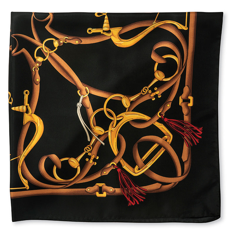 A square black scarf featuring an intricate graphic print of interwoven golden and brown leather reins and bits, with small red tassels, shown flat against a white background.