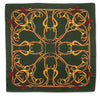 A square silk scarf featuring an intricate equestrian design with golden and brown horse bits and reins on a dark forest green background, finished with red tassels in the corners.