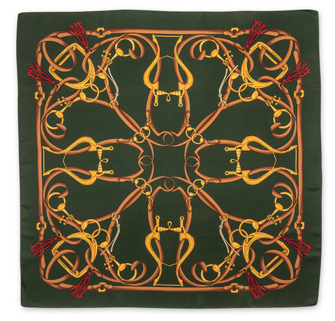A square silk scarf featuring an intricate equestrian design with golden and brown horse bits and reins on a dark forest green background, finished with red tassels in the corners.